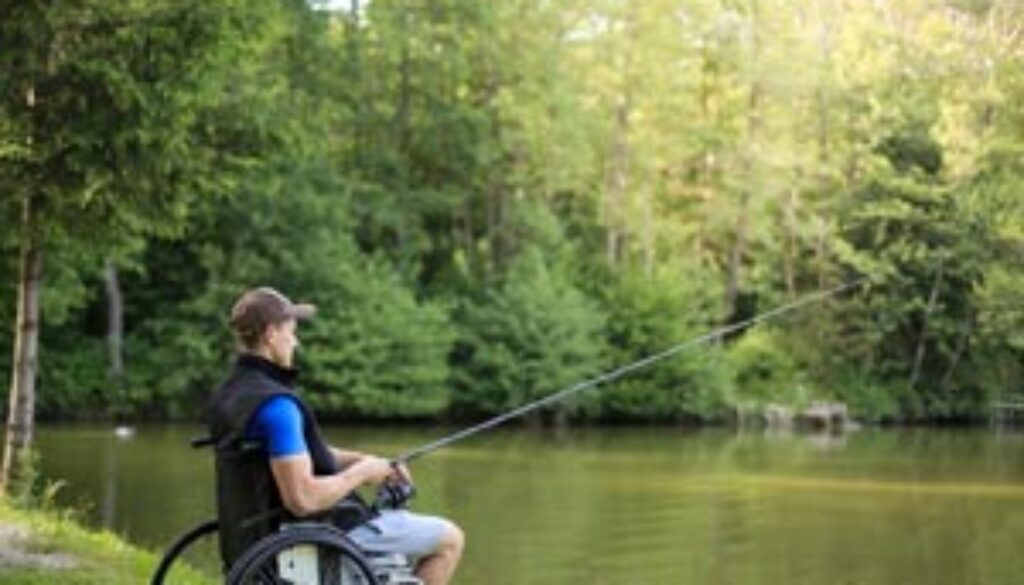 MND person fishing from a wheelchair