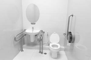 Certain toilets with self-washing features, along with installing rails, can be helpful when maneuvering the bathroom.
